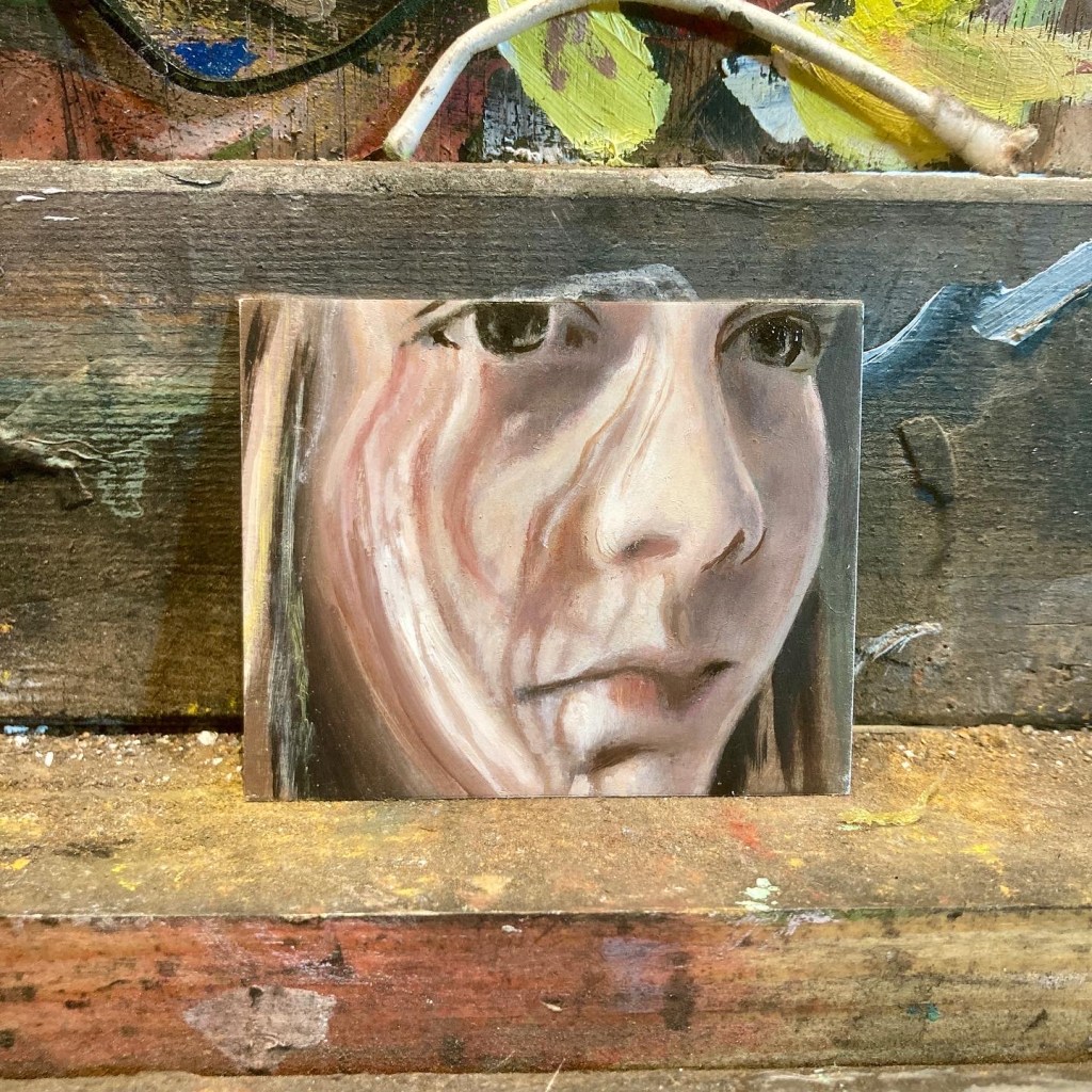 Small portrait of a girl. Painted using oil on aluminium. Size 6x5cm.